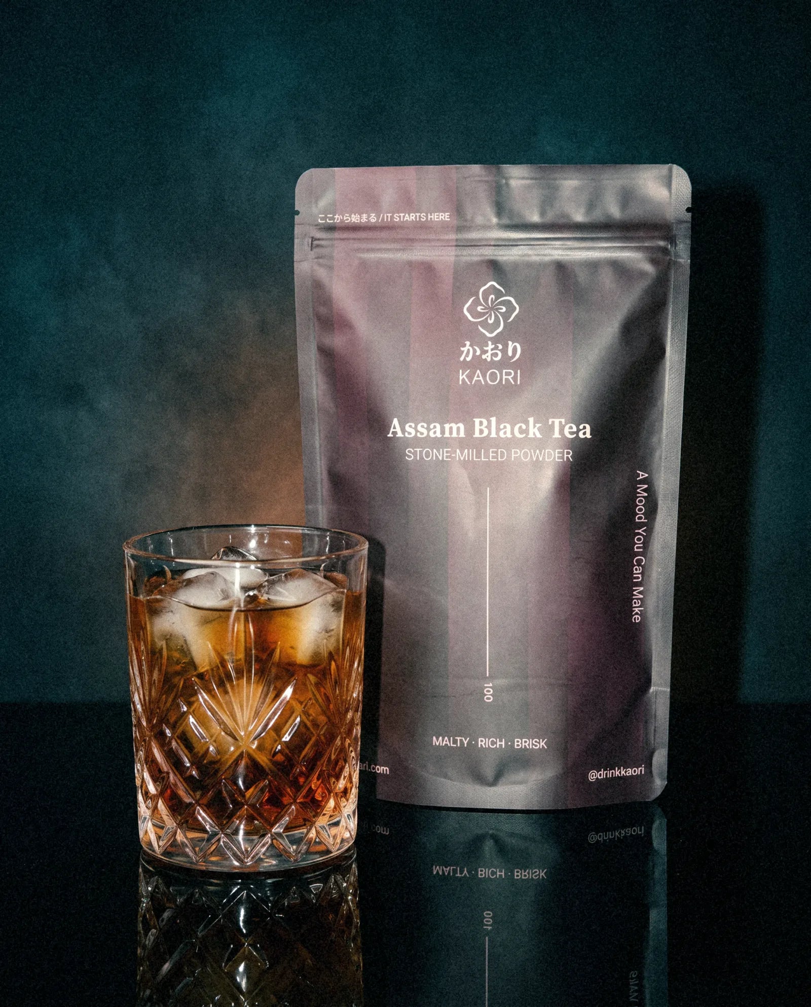 Assam Black Tea, the pouch beside an iced crystal tumbler