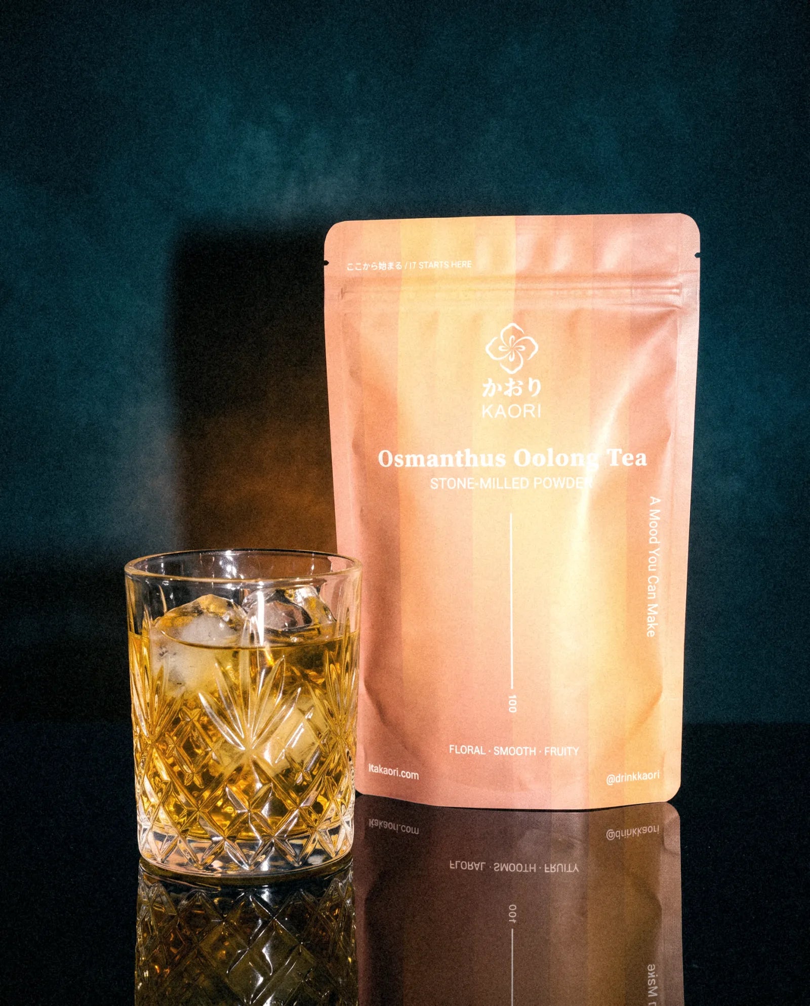 Osmanthus Oolong, the pouch beside an iced crystal tumbler